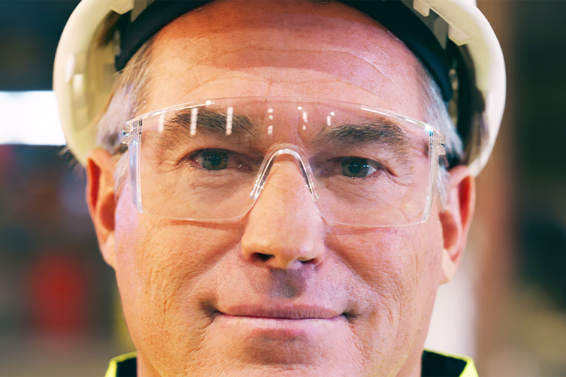 man using clear safety glasses