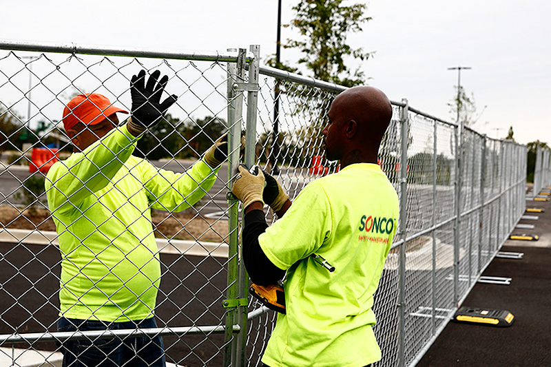 fence contractor repairing fence