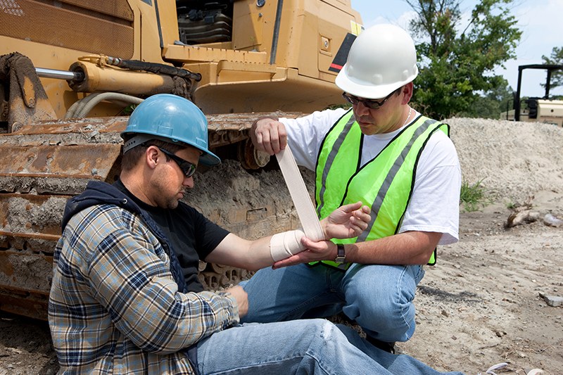 construction professionals getting medical assistance after an incident