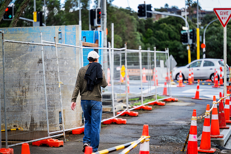pedestrian going by a construction zone